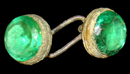 Cufflinks with large green faceted glass insets set in a plain mount - click on image to see larger view.